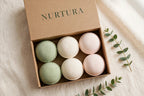 NURTURA-branded gift box of pastel bath bombs