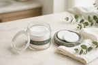 Nurtura toner pads jar on a bathroom vanity with towel and eucalyptus