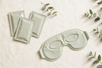 Nurtura Self-Heating Steam Eye Masks — mask and sachets flat lay with eucalyptus